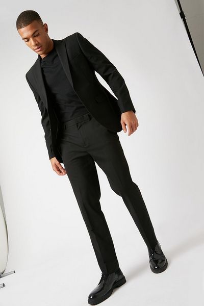 Matrix-inspired monochrome suits footwear