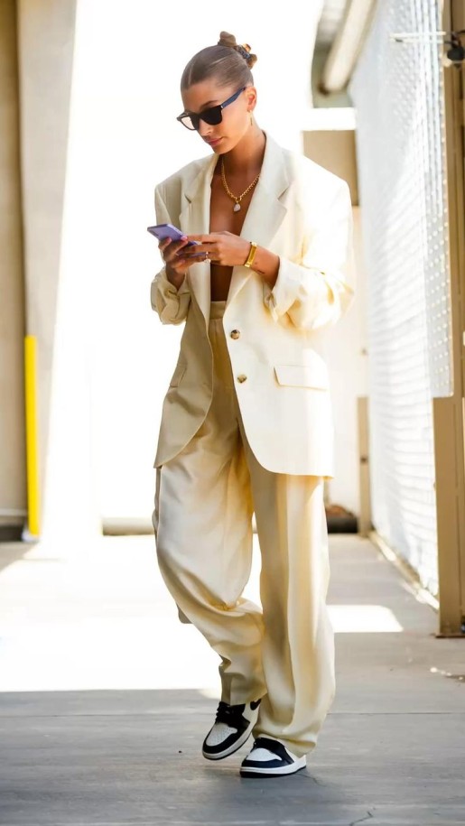 Hailey Bieber's oversized blazer in white with no shirt very sexy 