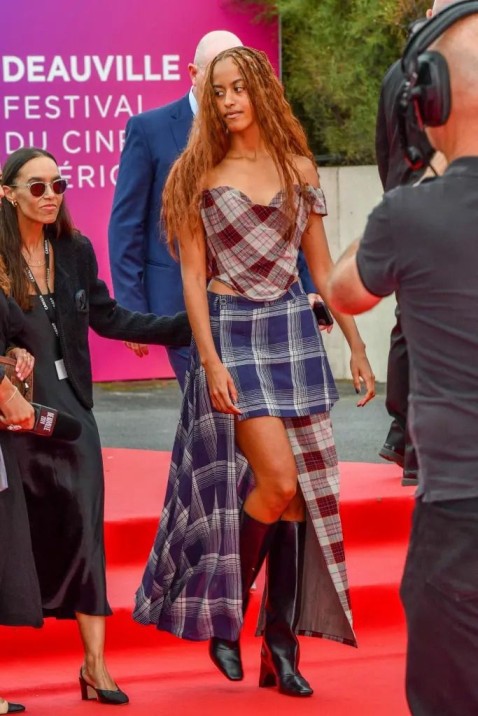 Malia Obama in plaid skirt and top