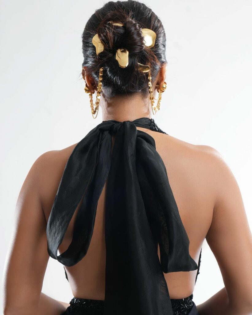 Bhumi Pednekar’s Black Gown with gold hair pieces