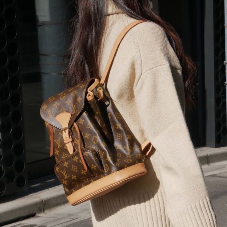 history of Louis Vuitton Girl with LV Backpack