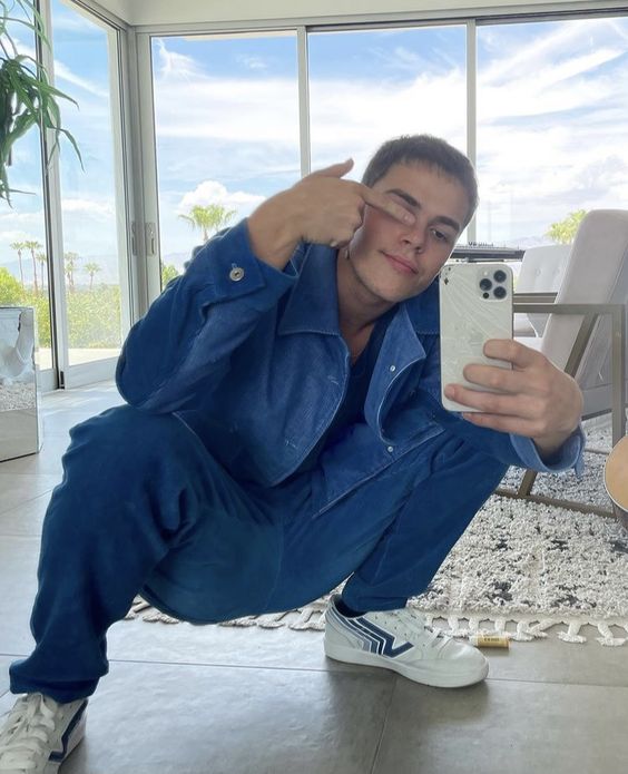 Aaron Fredrick Mitchell aka AJ Mitchell in graphic T and denim 