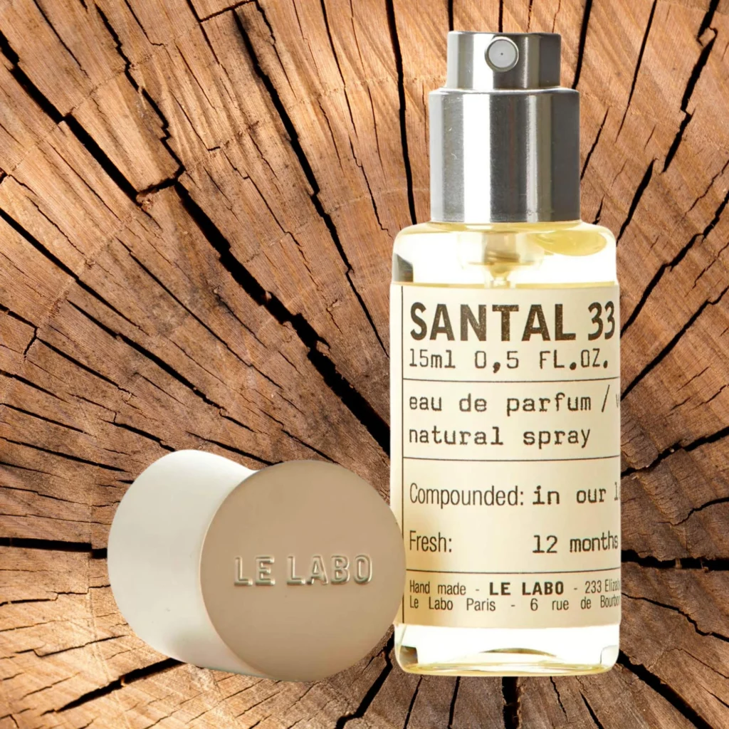 Le Labo Santal 33 Notes in front of wood 
