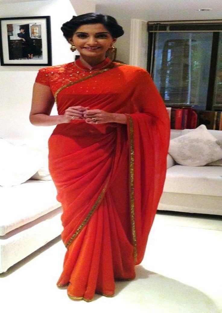  Iconic Sonam Kapoor Saree Styles orange dress