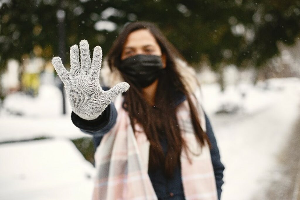 healthy skin in winter 7 Winter Skincare Tips wearing mask and gloves