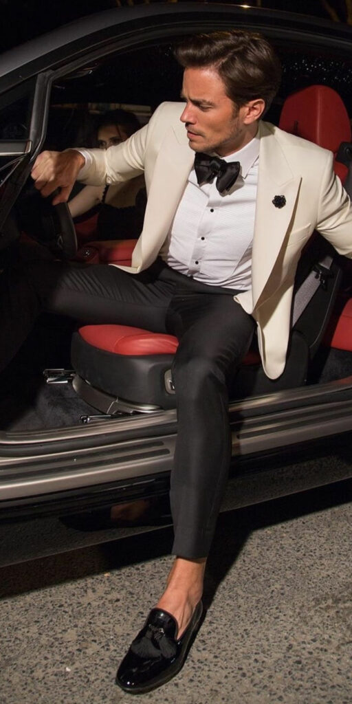 Patent leather loafers with white blazer in a car