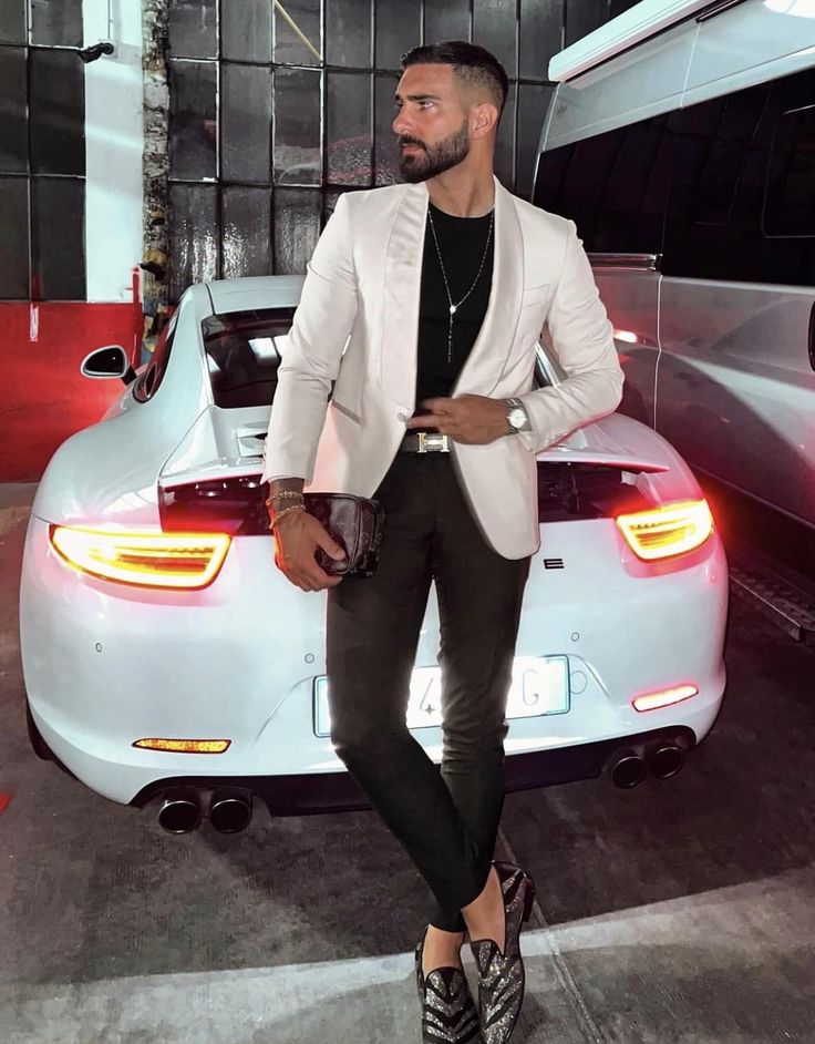 Patent leather loafers standing behind car