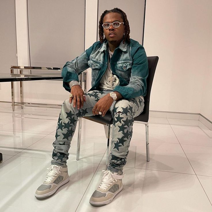 Gunna at glass table 