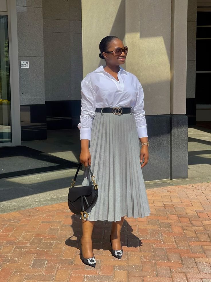 A fitted t-shirt brings casual chic sophistication to pleated skirts