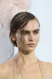 emerging fashion models with feather in hair