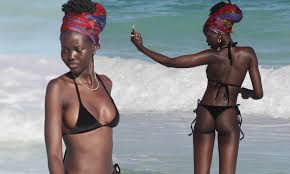 emerging fashion models in black G strin bikini