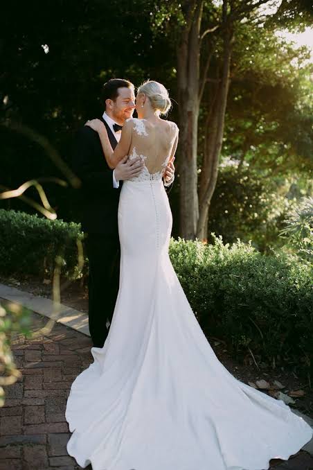 bridal fashion trends for 2025 classic wedding dress with long train 