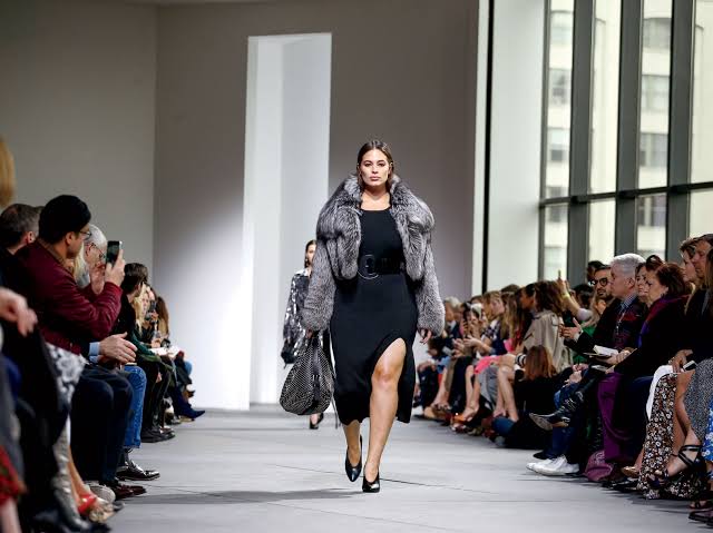 plus-size fashion show woman in gray coat