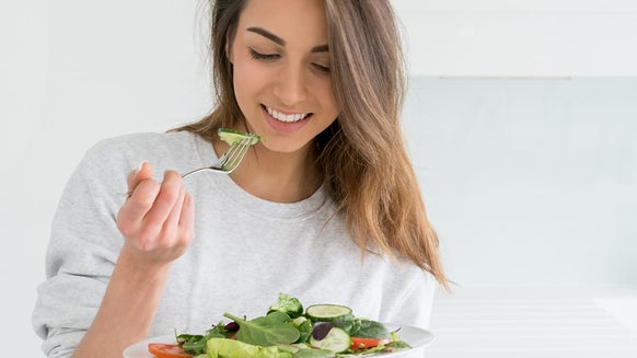 Woman eating salad