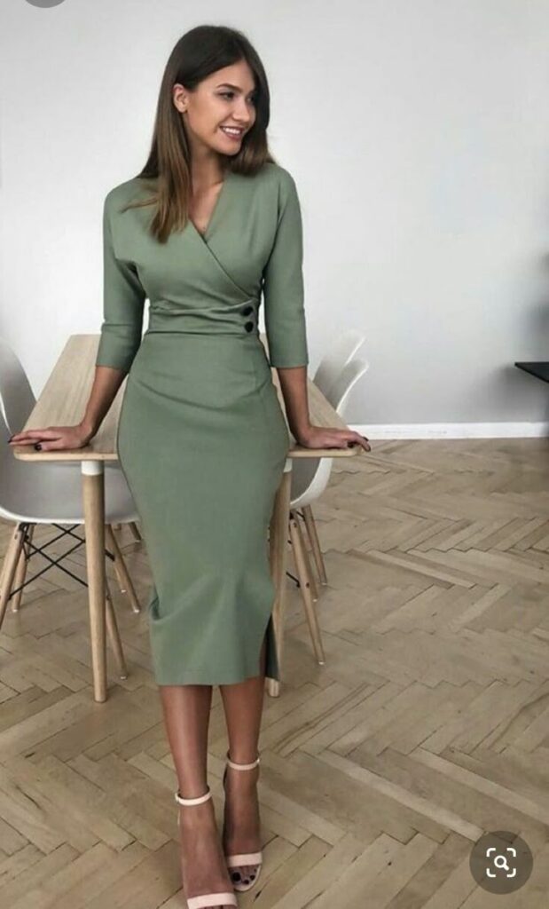 girl leaning on desk wearing A-line dress