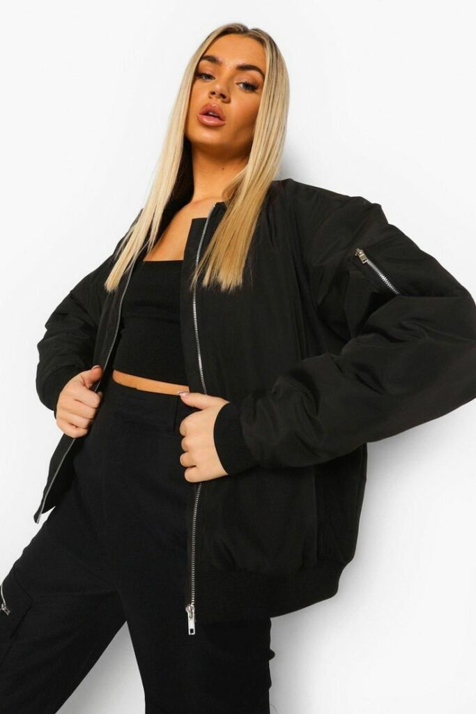 Blonde woman in black bomber jacket 