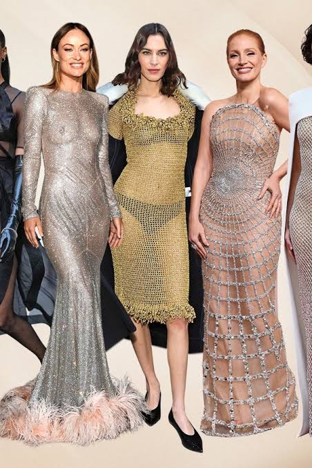 3 models wearing layered and transparent fabrics
