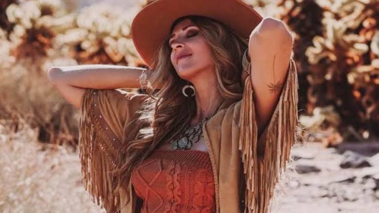 Summer of 2025 woman in hat and jacket 