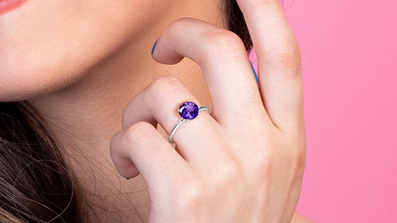 December birthstone hand with purple stoned ring