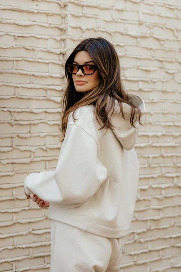 luxury loungewear girl in sweats in glasses