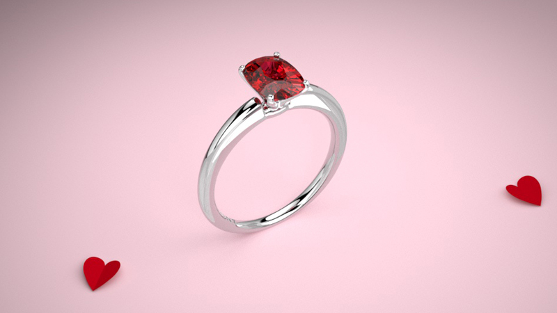 ruby ring on pink background with hearts