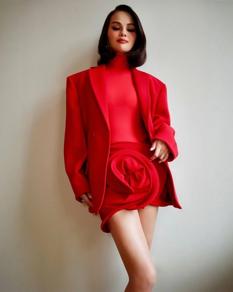 Selena Gomez in Magda Butrym crimson suit posing