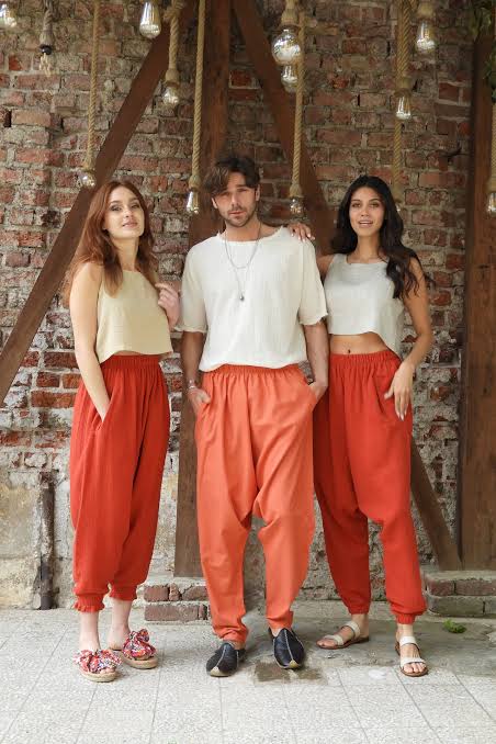 3 models in orange baggy pants