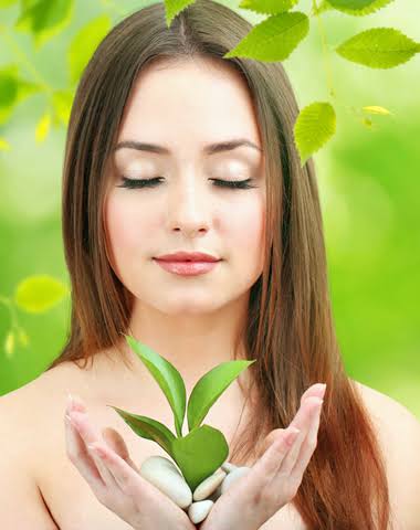 woman with plant growing from hands