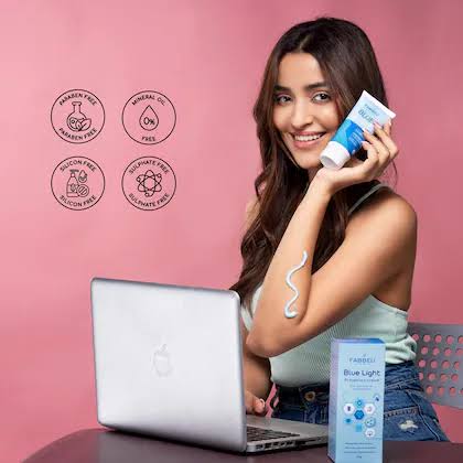 skincare trends girl holding tube of skincare lotion 