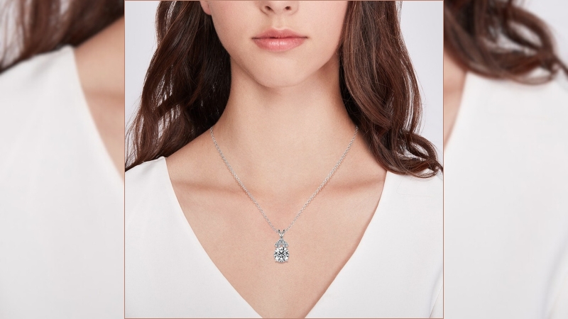 woman in white shirt wearing a lab diamond pendant