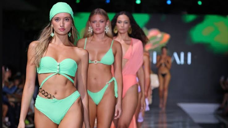 Runway models in Earth olors at Miami Swim Week