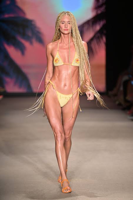 Long blond haired model with dread locks at Miami Swim Week