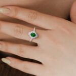 Featured image of hands wearing emerald and diamond ring
