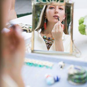 COUTURE Show Las Vegas woman applying lipstick 
