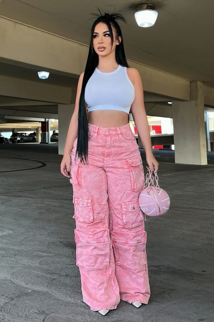 woman wearing white top and pink cargo pants