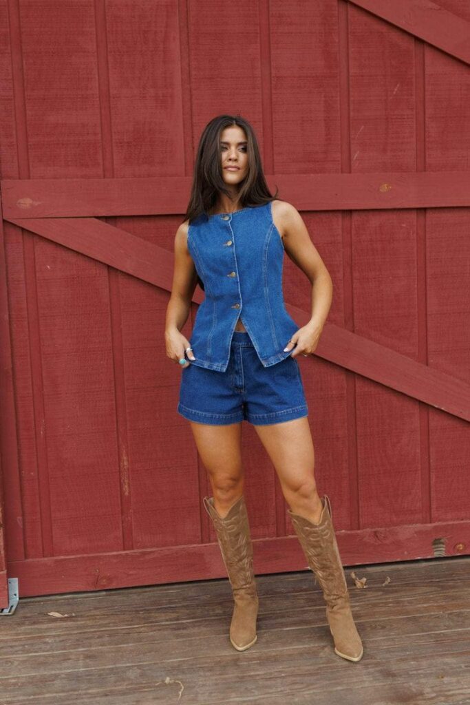 Girl in front of a barn wearting skirt and top made of Western denim