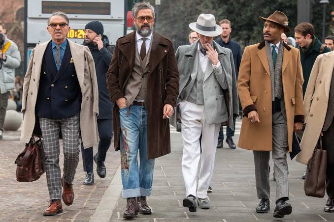 Older men in various suits at Pitti Uomo 2025