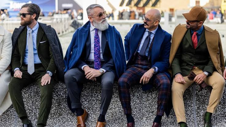 mature men wearing suits at Pitti Uomo 2025