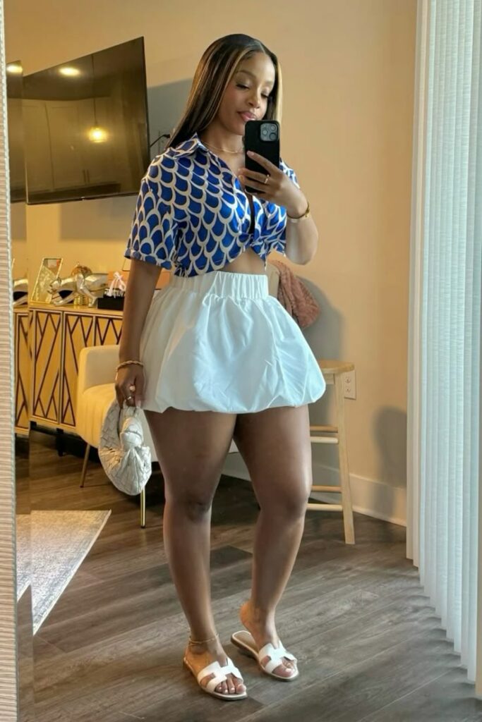 woman wearing blue croptop and white bubble skirt