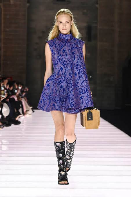 Model wearing purple Chanel on the runway Cruise 2026 runway season
