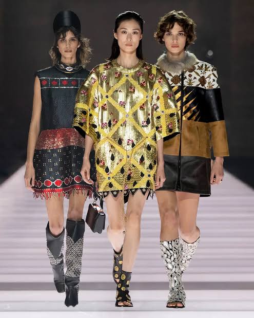 3 girls wearing Koprean styles with a twist on the runway