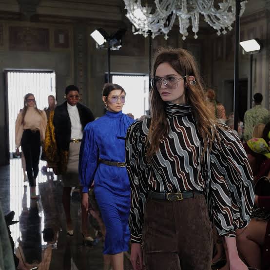 Models at a Gucci show Cruise 2026 runway season