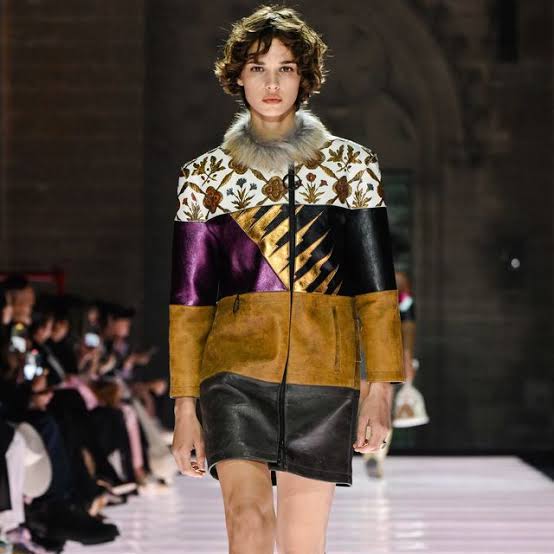 Model wearing short dress with multi textures Cruise 2026 runway season