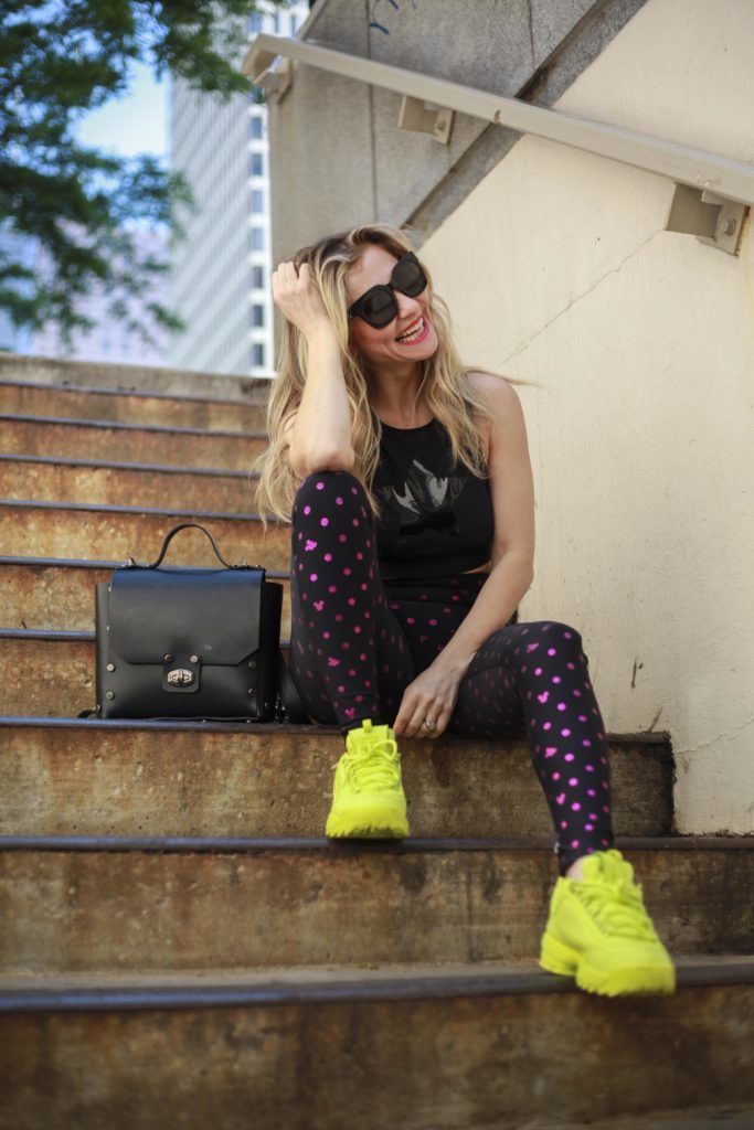 woman wearing yellow bright colored sneakers 