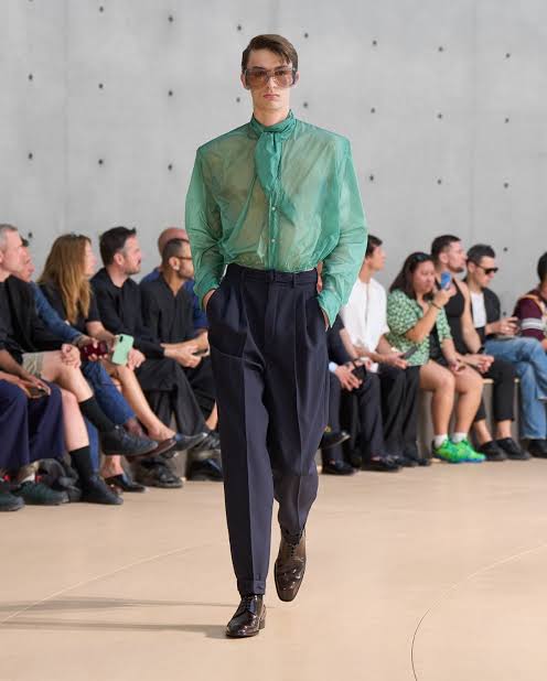 model wearing green see through shirt at Paris Fashion Week Men’s 2025
