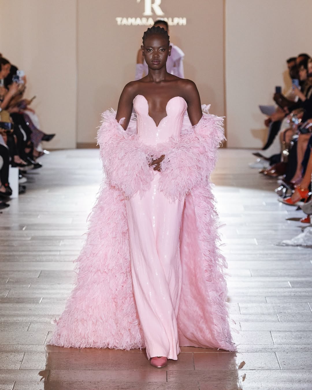 Tamara Ralph Haute Couture’s Fall/Winter 2024-2025 collection featured a candy pink liquid sequin gown and an ostrich feather cape.