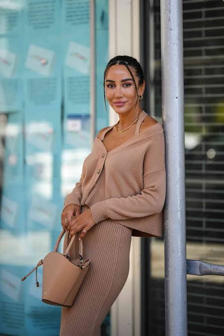 Woman wearing pink dress and sweater displaying Sheer & Balletcore