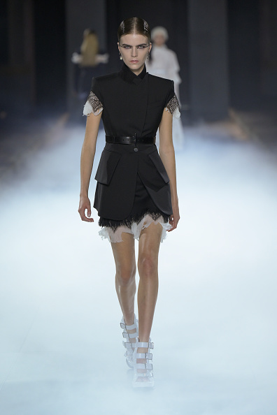 Seán McGirr’s Alexander McQueen Spring/Summer 2025 collection at Paris Ready-to-Wear Fashion Week featured a black cobweb lace jacket and a tiny skirt suit with a T-bar hip belt, which inspired Rachel Brosnahan’s look at the “Superman” London photocall.