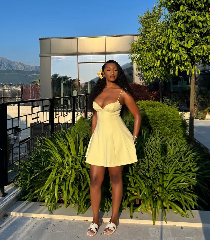 woman wearing butter yellow dress for color trends of Summer 2025