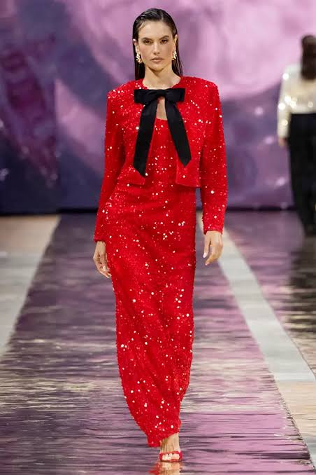 model wearing red dress at the runway show